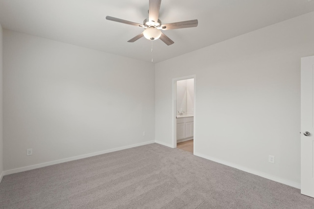 21406 George Wayne Way, Spring, TX 77379 - spare room featuring light colored carpet, ceiling fan, baseboards, and a sink