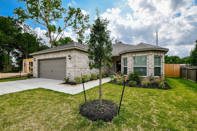 6607 Apollo, Houston, TX 77091 - view of front of property with driveway, brick siding, and a garage