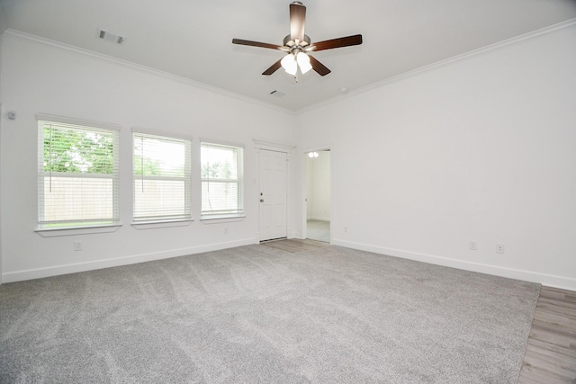 6607 Apollo, Houston, TX 77091 - unfurnished room featuring crown molding, a ceiling fan, plenty of natural light, and baseboards