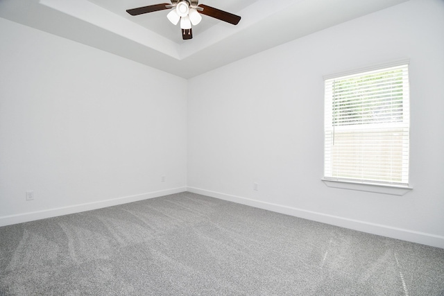 6607 Apollo, Houston, TX 77091 - carpeted empty room with a ceiling fan, a tray ceiling, and baseboards
