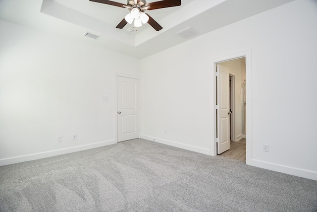 6607 Apollo, Houston, TX 77091 - carpeted empty room featuring a tray ceiling, a ceiling fan, and baseboards
