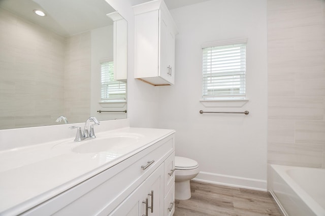 6607 Apollo, Houston, TX 77091 - full bath with vanity, toilet, wood finished floors, baseboards, and shower / tub combination
