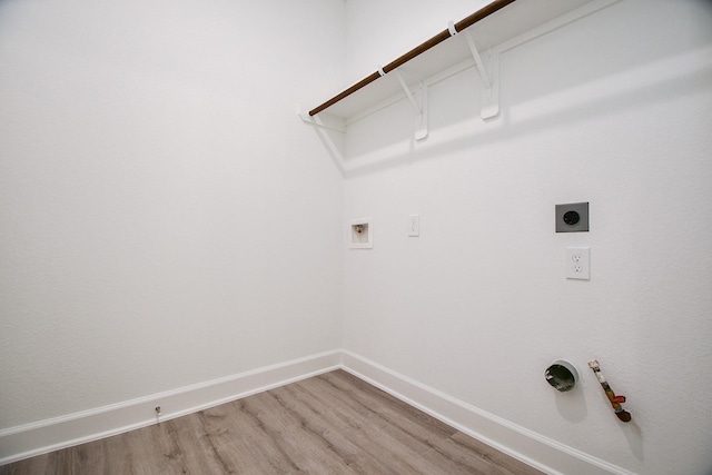 6607 Apollo, Houston, TX 77091 - laundry area featuring electric dryer hookup, hookup for a gas dryer, washer hookup, light wood finished floors, and baseboards