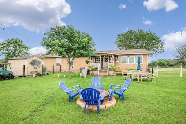 305-335 Omalley Rd, Brenham, TX 77833 - rear view of house featuring an outdoor fire pit