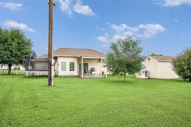 305-335 Omalley Rd, Brenham, TX 77833 - rear view of house featuring a trampoline and a patio