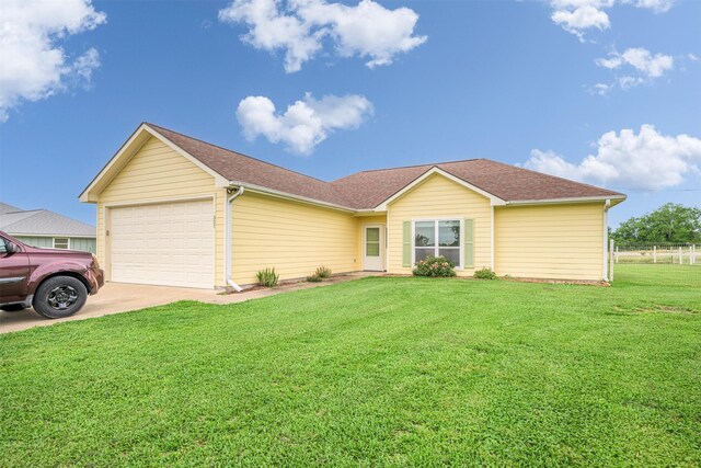 305-335 Omalley Rd, Brenham, TX 77833 - ranch-style home featuring an attached garage, driveway, and roof with shingles