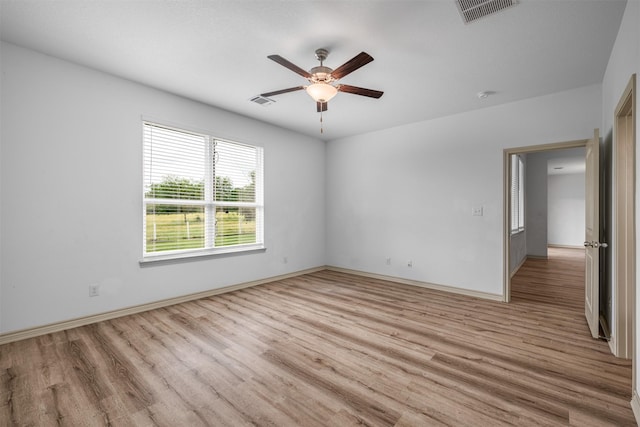 305-335 Omalley Rd, Brenham, TX 77833 - unfurnished room featuring ceiling fan, light wood finished floors, and baseboards