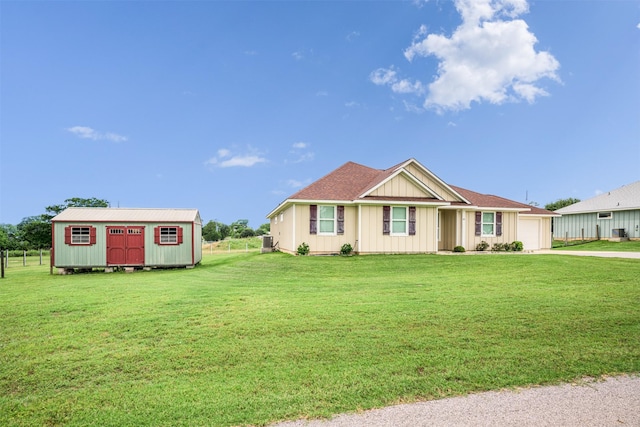 305-335 Omalley Rd, Brenham, TX 77833 - view of front of home featuring driveway, a garage, a front lawn, and board and batten siding