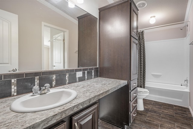 305-335 Omalley Rd, Brenham, TX 77833 - full bath with toilet, vanity, crown molding, shower / bath combo, and decorative backsplash