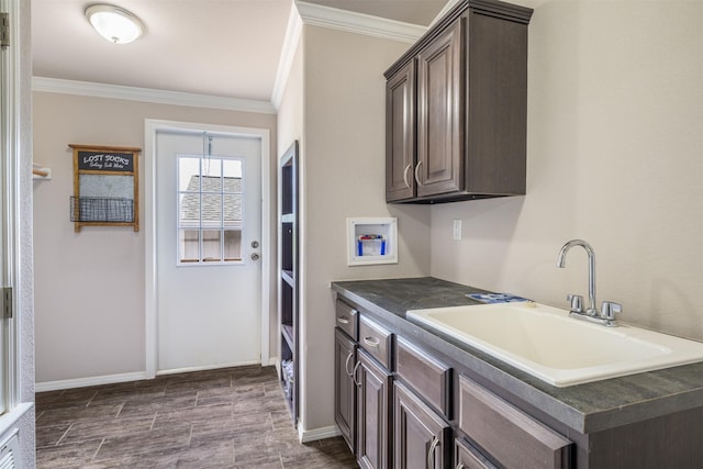 305-335 Omalley Rd, Brenham, TX 77833 - laundry room with ornamental molding, cabinet space, washer hookup, baseboards, and dark wood-type flooring