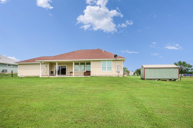 305-335 Omalley Rd, Brenham, TX 77833 - rear view of house featuring board and batten siding, a lawn, a patio, and a shingled roof