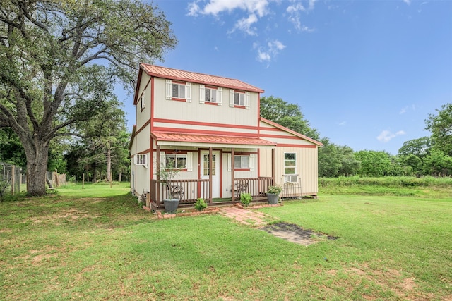 305-335 Omalley Rd, Brenham, TX 77833 - view of front of house featuring metal roof, a front lawn, cooling unit, and a porch
