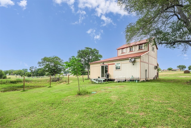305-335 Omalley Rd, Brenham, TX 77833 - rear view of property with metal roof and a lawn