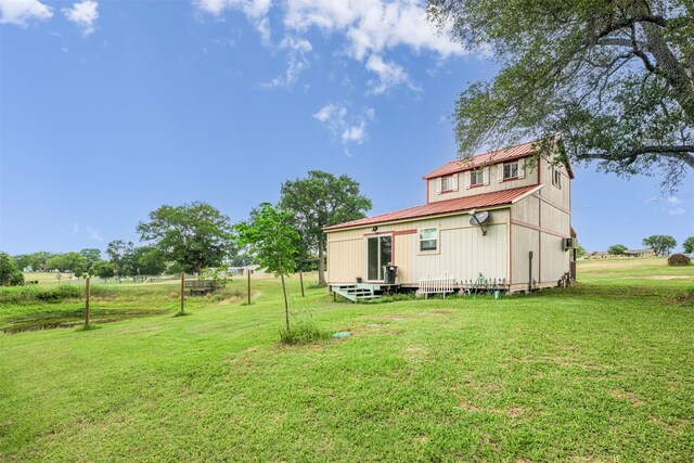 305-335 Omalley Rd, Brenham, TX 77833 - back of property with metal roof and a lawn