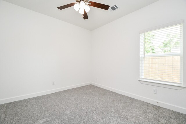 6822 Tuskegee St, Houston, TX 77091 - spare room with carpet flooring, a ceiling fan, and baseboards