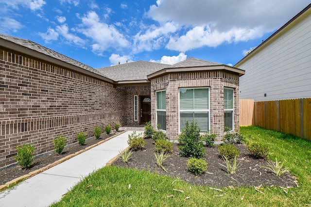 6710 Utah St, Houston, TX 77091 - view of exterior entry featuring brick siding
