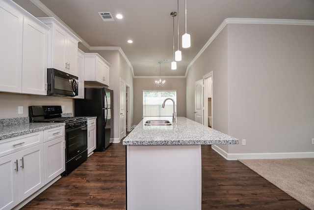 6710 Utah St, Houston, TX 77091 - kitchen featuring black appliances, a sink, crown molding, an island with sink, and white cabinetry