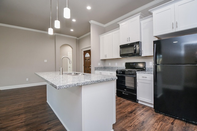 6710 Utah St, Houston, TX 77091 - kitchen with black appliances, a sink, crown molding, dark wood finished floors, and a kitchen island with sink