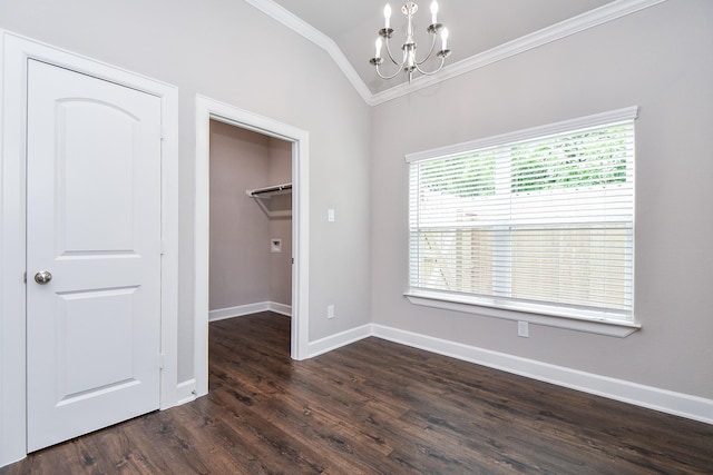 6710 Utah St, Houston, TX 77091 - unfurnished bedroom featuring crown molding, a chandelier, a walk in closet, dark wood-type flooring, and a closet