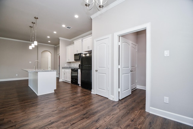 6710 Utah St, Houston, TX 77091 - kitchen featuring black appliances, ornamental molding, white cabinets, baseboards, and recessed lighting
