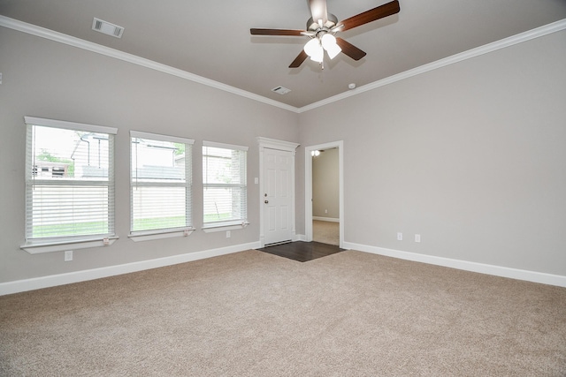 6710 Utah St, Houston, TX 77091 - unfurnished room featuring dark carpet, plenty of natural light, baseboards, and crown molding