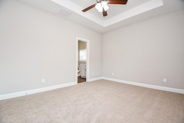 6710 Utah St, Houston, TX 77091 - unfurnished room with a raised ceiling, carpet floors, ceiling fan, and baseboards