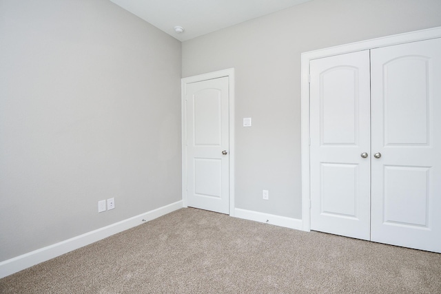 6710 Utah St, Houston, TX 77091 - unfurnished bedroom with carpet, a closet, and baseboards