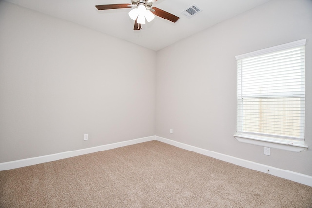 6710 Utah St, Houston, TX 77091 - spare room with a ceiling fan, light colored carpet, and baseboards