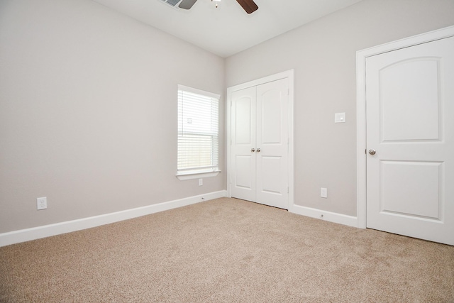 6710 Utah St, Houston, TX 77091 - unfurnished bedroom featuring carpet, a closet, baseboards, and a ceiling fan