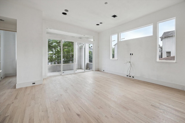 4232 Feagan St, Houston, TX 77007 - unfurnished living room with healthy amount of natural light, wood finished floors, and baseboards