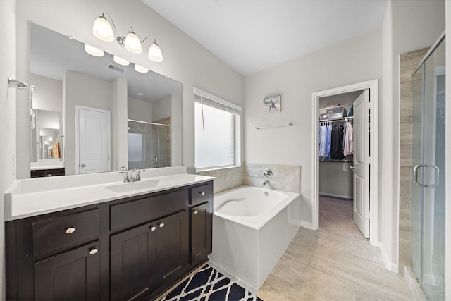 5442 Atwood Canyon Ct, Richmond, TX 77407 - full bath featuring a shower stall, vanity, a garden tub, and a spacious closet