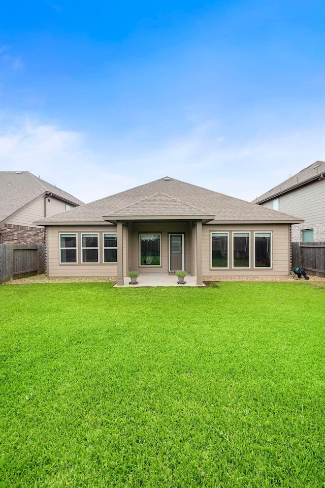 5442 Atwood Canyon Ct, Richmond, TX 77407 - back of house featuring a shingled roof and a patio
