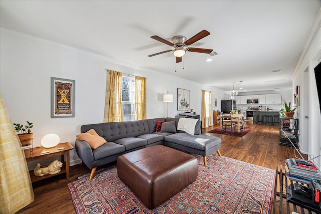 1101 E 38th St, Houston, TX 77022 - living area with ceiling fan, dark wood-type flooring, ornamental molding, baseboards, and recessed lighting