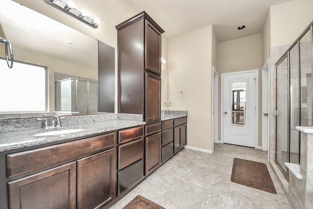 13906 Mowbray Ct, Richmond, TX 77407 - full bath featuring a shower stall, double vanity, and baseboards