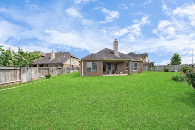 13906 Mowbray Ct, Richmond, TX 77407 - rear view of property with brick siding, a patio area, and a chimney