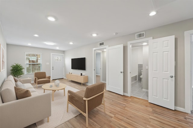 1405 Shadowdale Dr Unit 73, Houston, TX 77043 - living room with light wood-type flooring, recessed lighting, and baseboards