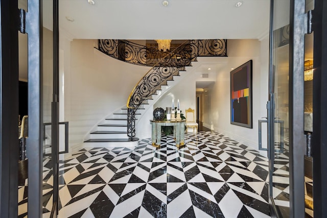 2307 River Oaks Blvd, Houston, TX 77019 - foyer entrance with stairs, baseboards, a chandelier, and french doors