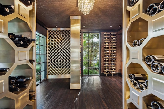 2307 River Oaks Blvd, Houston, TX 77019 - wine area with wood finished floors and a chandelier
