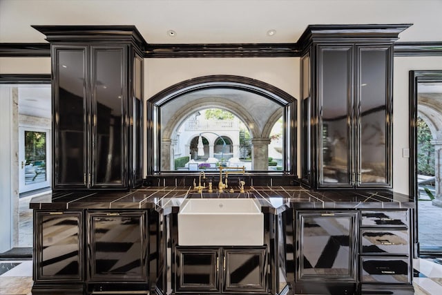 2307 River Oaks Blvd, Houston, TX 77019 - bar featuring a sink and crown molding