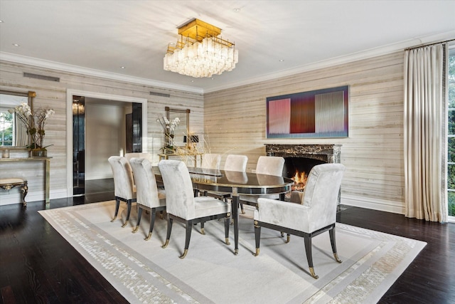 2307 River Oaks Blvd, Houston, TX 77019 - dining space featuring ornamental molding, a chandelier, baseboards, wooden walls, and a high end fireplace
