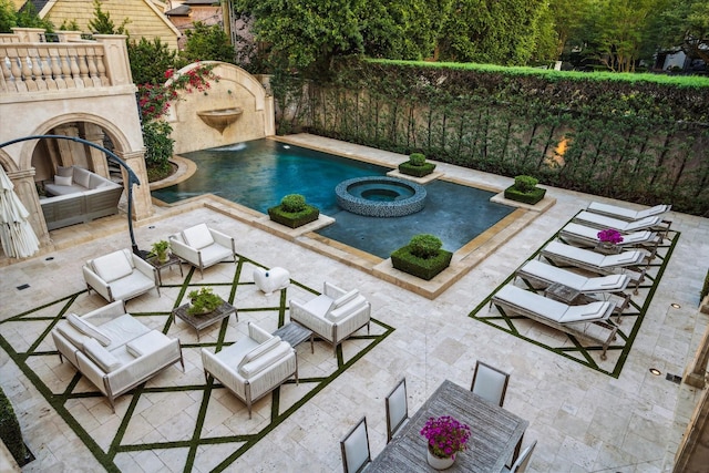 2307 River Oaks Blvd, Houston, TX 77019 - view of swimming pool featuring a patio, a pool with connected hot tub, and an outdoor hangout area