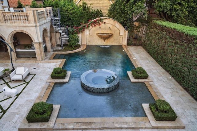 2307 River Oaks Blvd, Houston, TX 77019 - view of swimming pool featuring a patio and a pool with connected hot tub