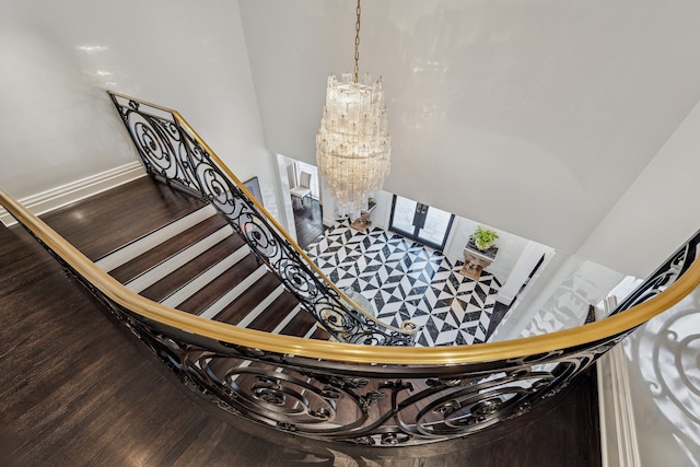 2307 River Oaks Blvd, Houston, TX 77019 - staircase with a chandelier and wood finished floors