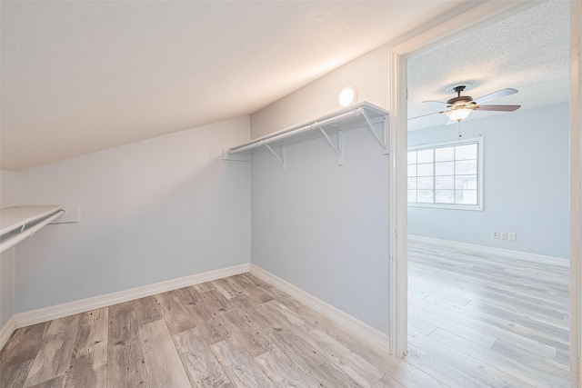 2115 Streamcrest Ln, Sugar Land, TX 77479 - walk in closet featuring ceiling fan and light wood-style floors
