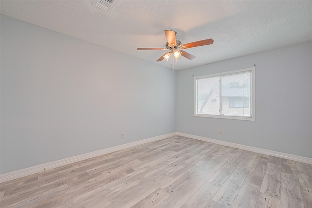 2115 Streamcrest Ln, Sugar Land, TX 77479 - unfurnished room with a ceiling fan, light wood-type flooring, baseboards, and a textured ceiling