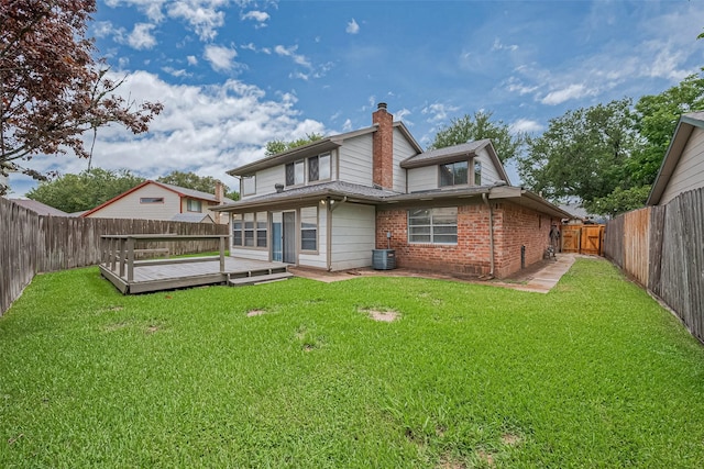 2115 Streamcrest Ln, Sugar Land, TX 77479 - rear view of house with brick siding, a wooden deck, central AC, and a chimney