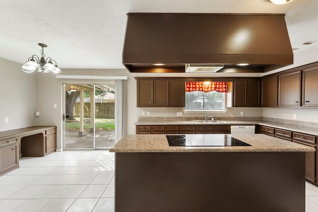 4807 Wind Chimes Dr, Houston, TX 77066 - kitchen featuring black electric cooktop, a sink, a chandelier, light tile patterned floors, and dark brown cabinets