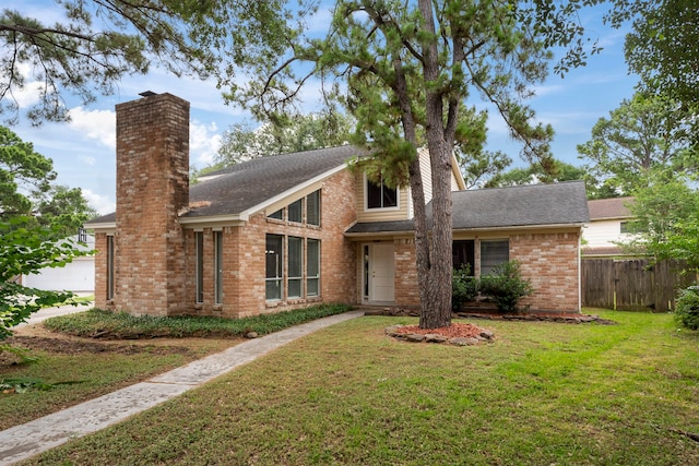 4807 Wind Chimes Dr, Houston, TX 77066 - mid-century home with a chimney, brick siding, and roof with shingles