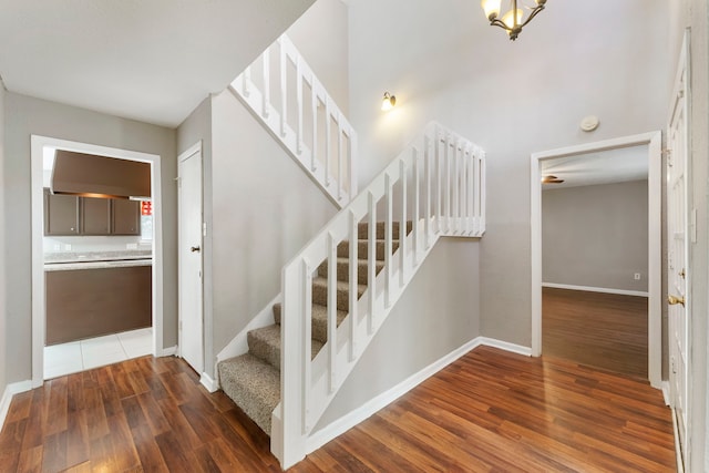 4807 Wind Chimes Dr, Houston, TX 77066 - staircase with wood finished floors and baseboards
