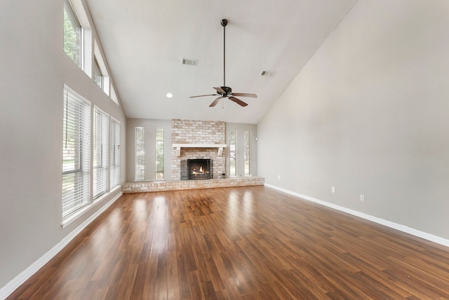 4807 Wind Chimes Dr, Houston, TX 77066 - unfurnished living room with baseboards, wood finished floors, a ceiling fan, high vaulted ceiling, and a fireplace